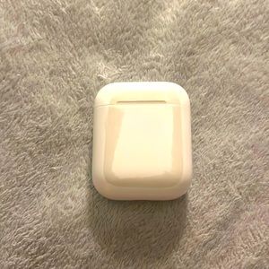 Apple AirPods gen 1. No box. Stain on the case. Works like new
